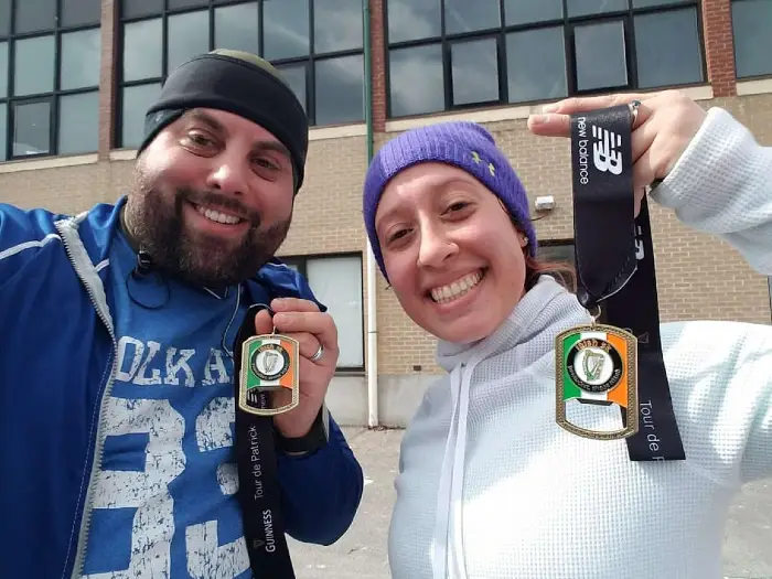 Seth and Felicia, his sister, holding medals for finishing a 5k race